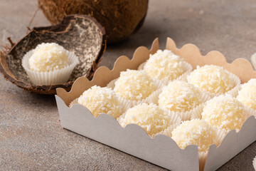 Set of coconut truffles made of white chocolate, cream and coconut.