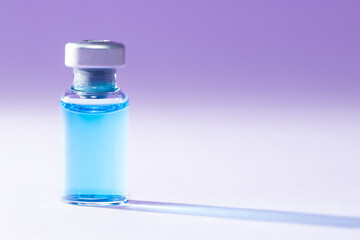 Close-up of a medical bottle with a blue liquid