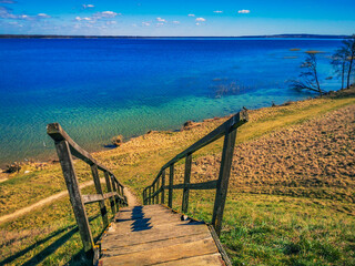 Stairs on mound with Ancient Settlement on the shore of lake Metelys, Lithuania