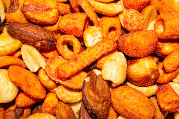 A mixture of different nuts. Healthy food, fitness diet. Surface texture. Close up.