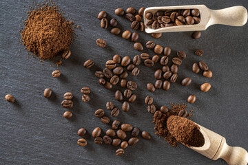 Cafe coffee background. Espresso beans for food, drink caffeine breakfast on black. Brown roasted coffee seeds isolated for energy mocha, cappuccino ingredient. Copy space, top view