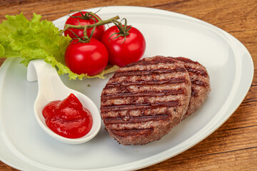 Grilled burger cutlet with sauce