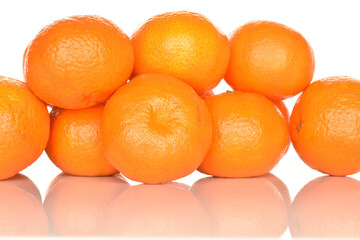 Bright yellow juicy, fresh, organic tangerines, close-up, on a white background.