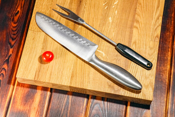 tomato on a chopping Board