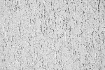 White plaster texture on an uneven surface