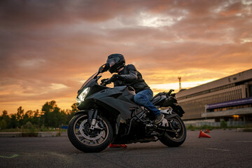 Obraz na płótnie Canvas biker on sunset