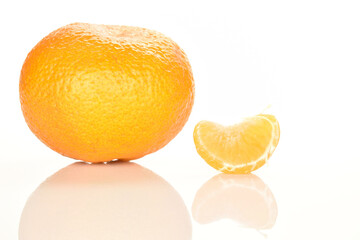 Bright yellow juicy, fresh, organic tangerines, close-up, on a white background.