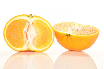 Bright yellow juicy, fresh, organic tangerines, close-up, on a white background.