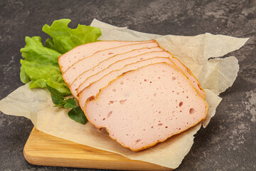 Boiled pork sausage over board