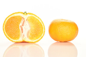 Bright yellow juicy, fresh, organic tangerines, close-up, on a white background.