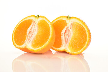 Bright yellow juicy, fresh, organic tangerines, close-up, on a white background.