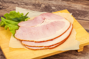 Sliced pork belly over board