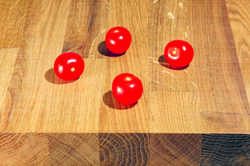 tomato on a chopping Board