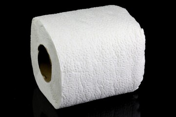roll of toilet paper on black background 
