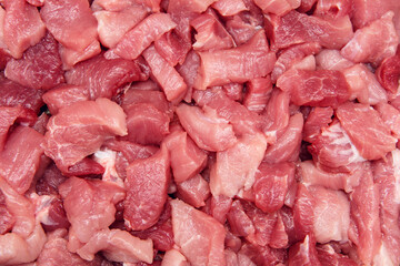 Sliced raw meat background. Cooking pork meat. Sliced meat on a cutting board. Ingredient for cooking