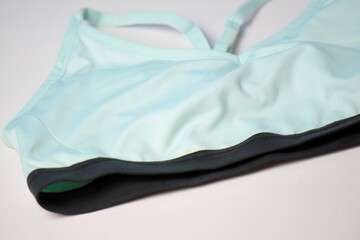 aqua blue sports bra on the table 