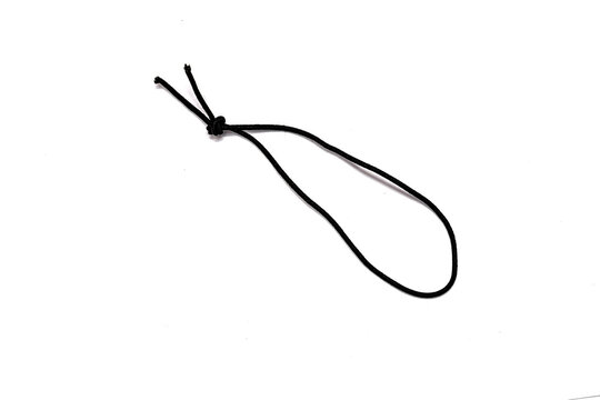 Black elastic band with knots isolated on white background