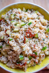 Healthy Salad with Barley, Sun Dried Tomatoes, Cucumber, Lemon Juice, Olive Oil and Herbs