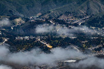 Clouds Hang low over Residential Neighborhoods Lining a Mountain Pass in Northern California