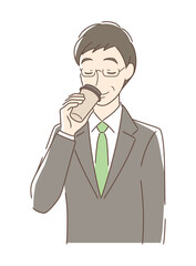 テイクアウトのコーヒーを飲む男性