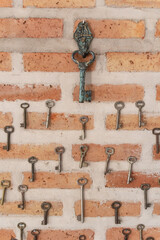 key collection on a old brick wall