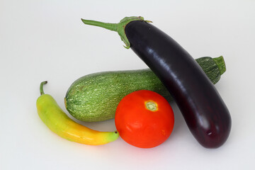 Tomatoes , zucchini, eggplant on isolated white background.