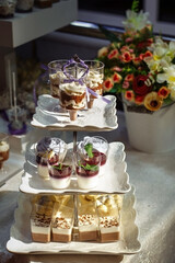 Desserts on a three-level stand. Holiday desserts. Candy bar.