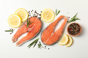 Composition with salmon meat and spices on white background, top view
