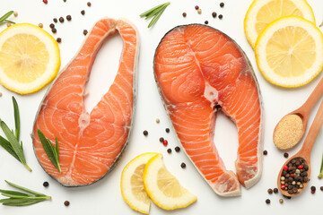 Composition with salmon meat and spices on white background, top view