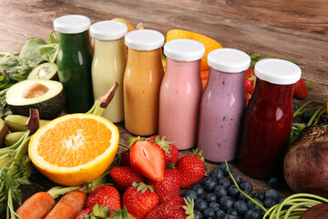Multicolored smoothies and juices from vegetables, greens, fruits and berries, food background. Detox and dieting, clean eating, healthy lifestyle concept