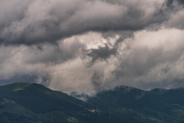 Fototapeta premium Mysterious black mountain with dramatic cloudy sky