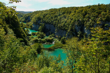 Fototapeta na wymiar Plitvice Lakes National Park, Croatia. Nacionalni park Plitvicka Jezera, one of the oldest and largest national parks. UNESCO World Heritage. View from above on turquoise lakes in rock valley.