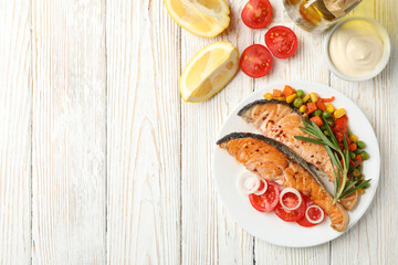 Composition with tasty grilled salmon on wooden background, top view