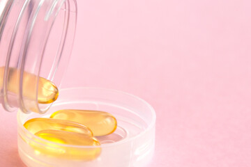 Fish oil capsules with omega 3 and vitamin D, healthy concept
