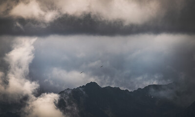 Mysterious black mountain with dramatic cloudy sky