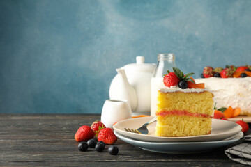 Composition with delicious berry cream cake on wooden table. Tasty dessert
