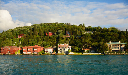 Fototapeta na wymiar City scene of buildings with mountain back and sea front in Istanbul