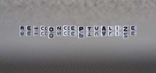 re conceptualize concept represented by black and white letter cubes on a grey horizon background stretching to infinity