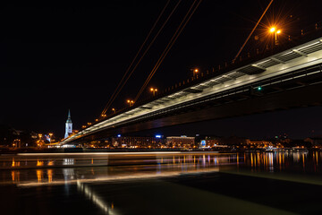 Fototapeta na wymiar Bratislava at night. River Danube and SNP bridge