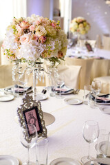 Stylish and luxuriously designed dining table for guests at the event.wedding composition. wedding decor,