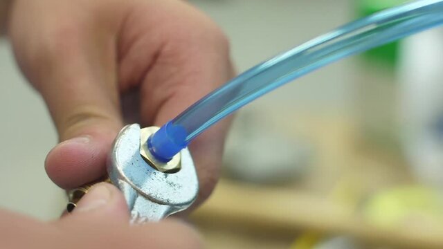 tighten brass nut with wrench in pneumatic automation system