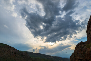 Fototapeta na wymiar Clouds over a beautiful picturesque gorge at Noravank Monastery, landscape of Armenia