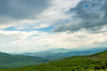 Panoramic view of the picturesque landscape of Armenia - mountains, fields and clouds