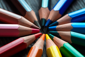Fototapeta premium multi-colored palette of pencils in a circle, close-up shot