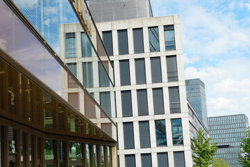 Corporate, Office buildings reflecting each other in their facades respective. Modern architecture using noble materials such as glass, chrome, polished stone or marble. 