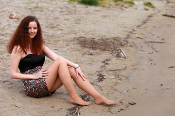 A girl at the river shore in spring