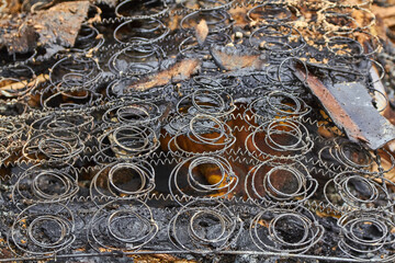 burnt bed in a house after fire in countryside