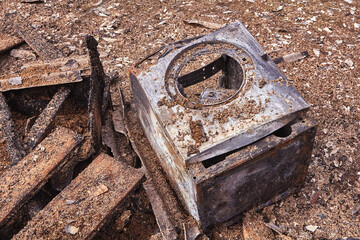 washing machine next to burnt house in countryside