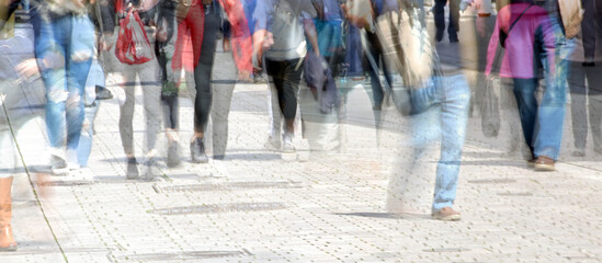 Crowd of abstract people walking in the shopping pedestrian zone, multiple exposure and motion blur, panoramic format, copy space - obrazy, fototapety, plakaty