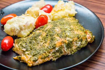 Baked Salmon Fillet with Herbs and Pesto served with Cauliflower and Cherry Tomato